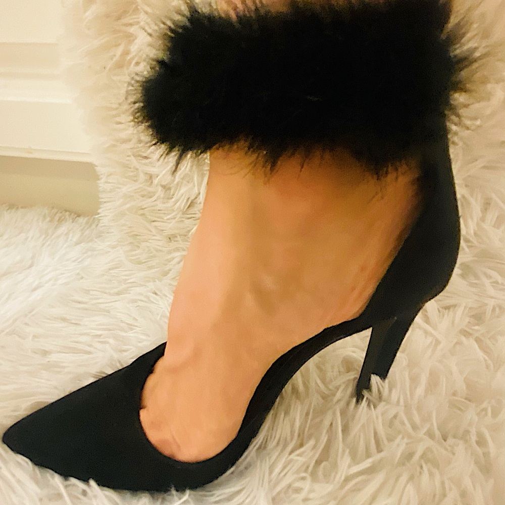 A sexy black stretchy furry ankle high heels